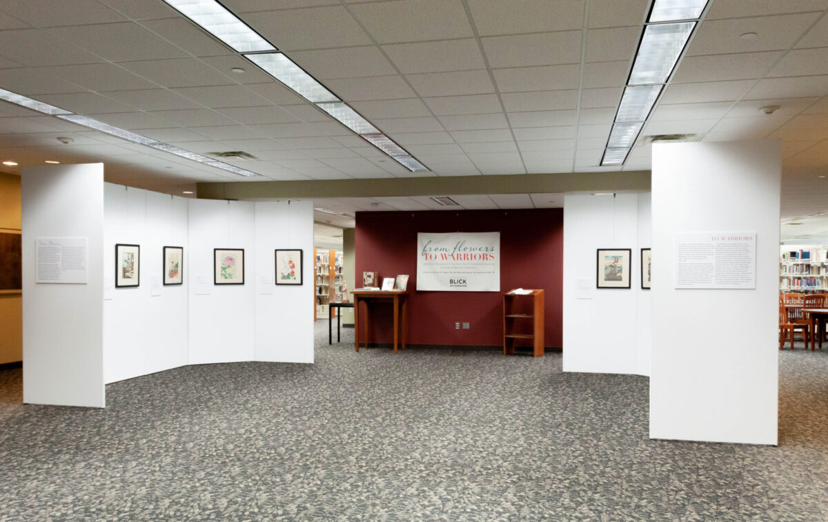 Installation view of From Flowers to Warriors in the St. Catherine University Library.